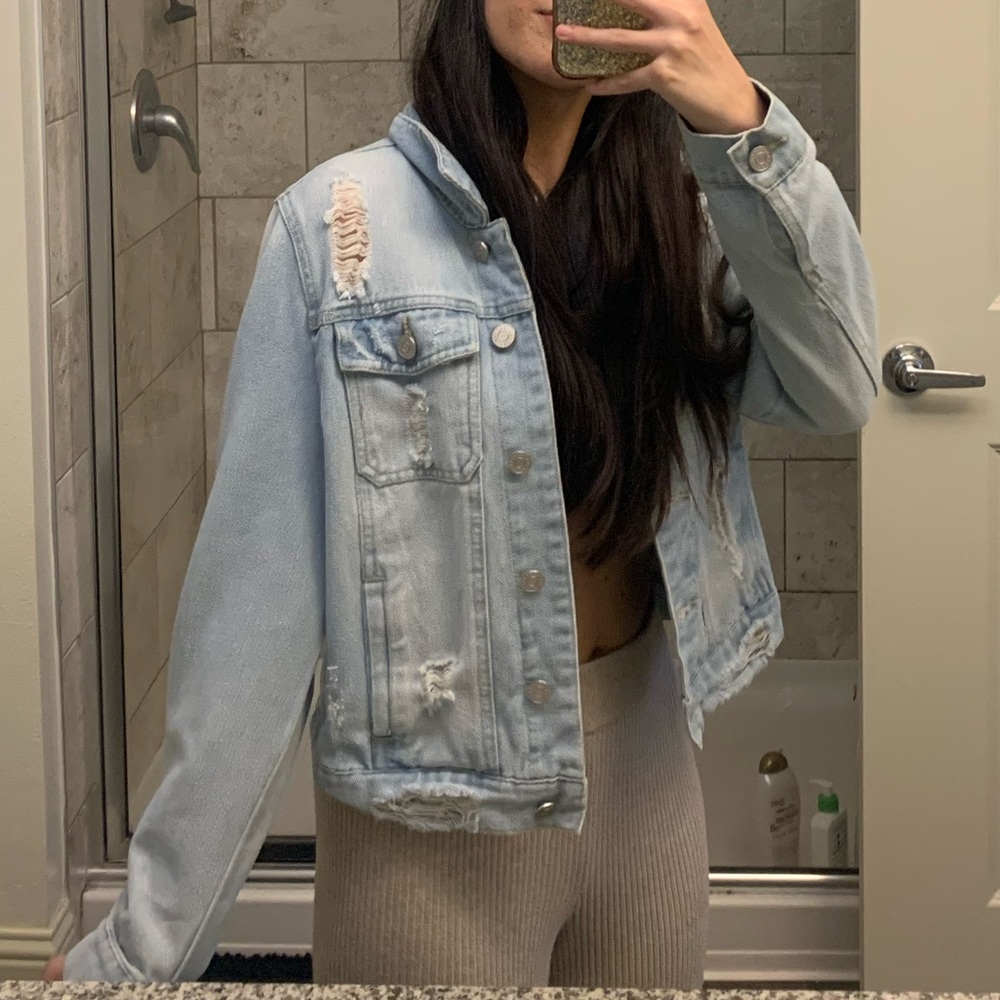 Distressed light wash denim jacket